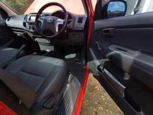Red toyota hilux driver's side door