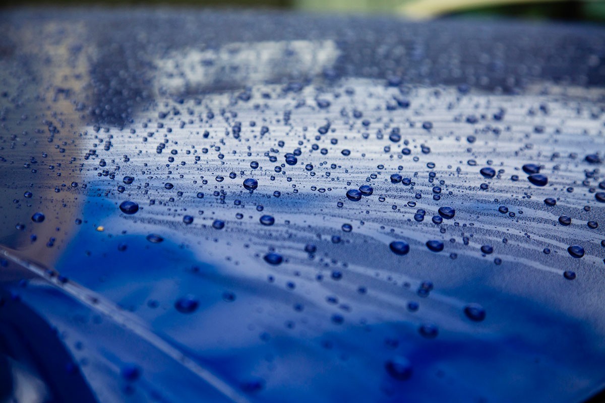water droplets on blue car